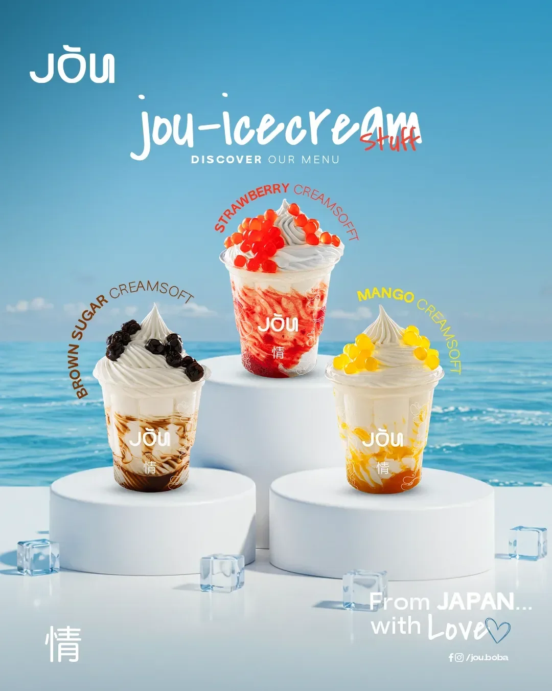 JŌU creamsoft layout: brown sugar, strawberry and mango soft-serve cups on white podiums above the sea
