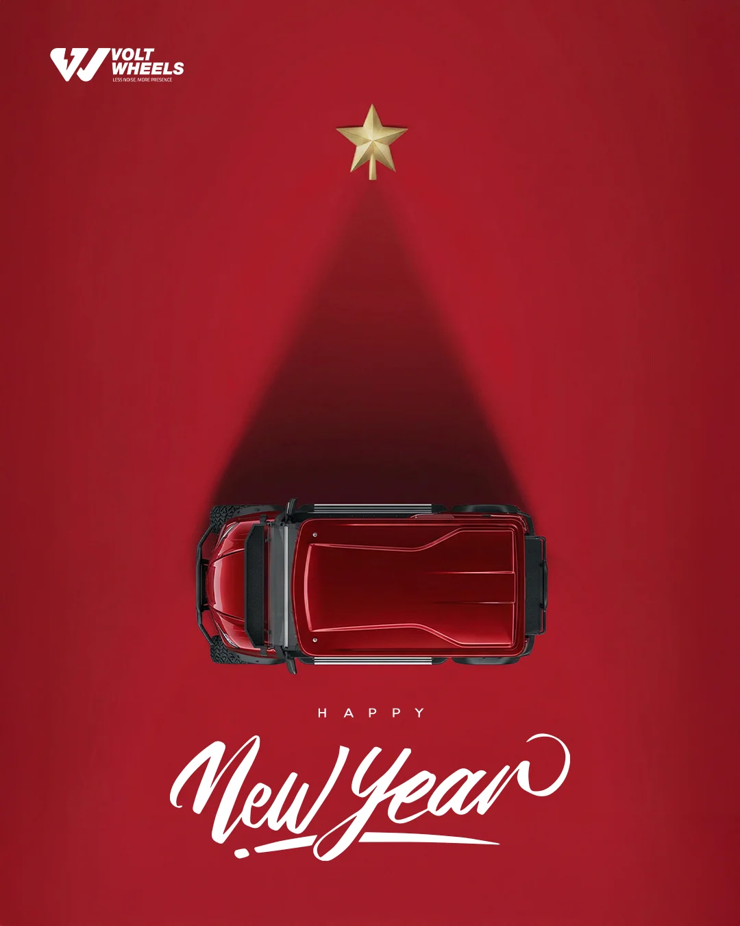 Volt Wheels New Year greeting: an overhead view of a red golf cart whose headlight beam forms a Christmas tree under a gold star