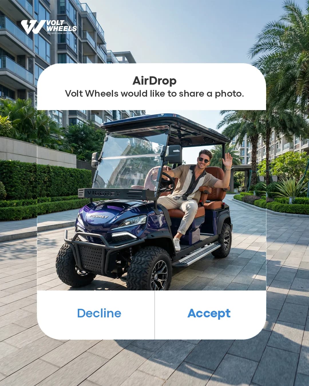 Volt Wheels post styled as an AirDrop prompt, showing a man waving from a navy Vigorey golf cart on a palm-lined residential street