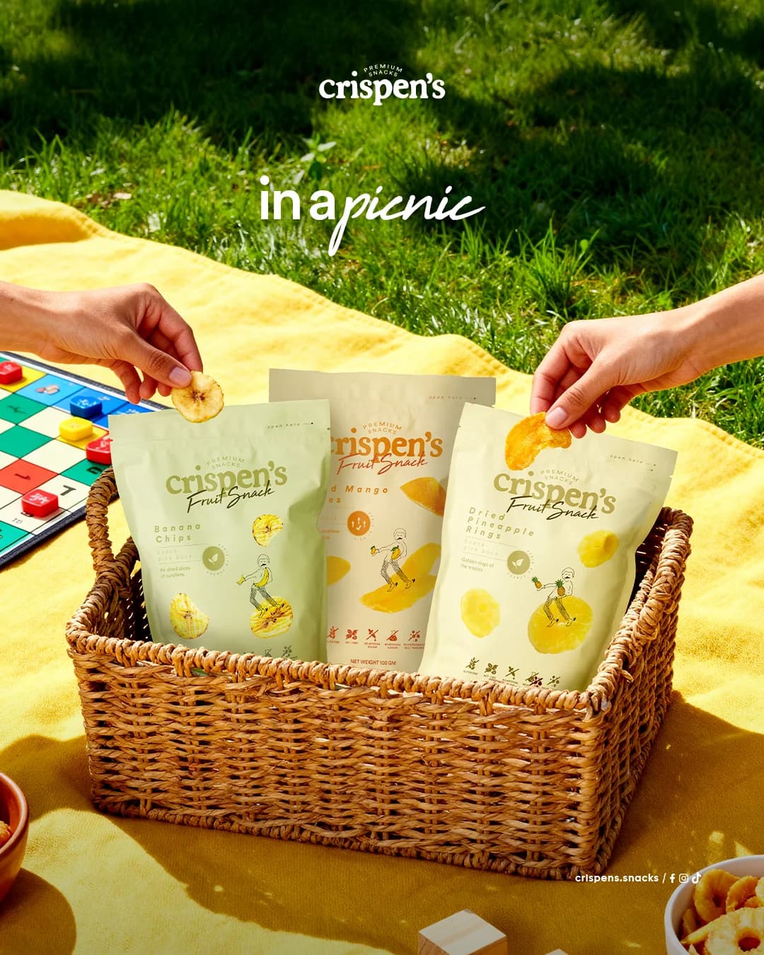 Crispen’s premium dried fruit snacks arranged in a picnic basket